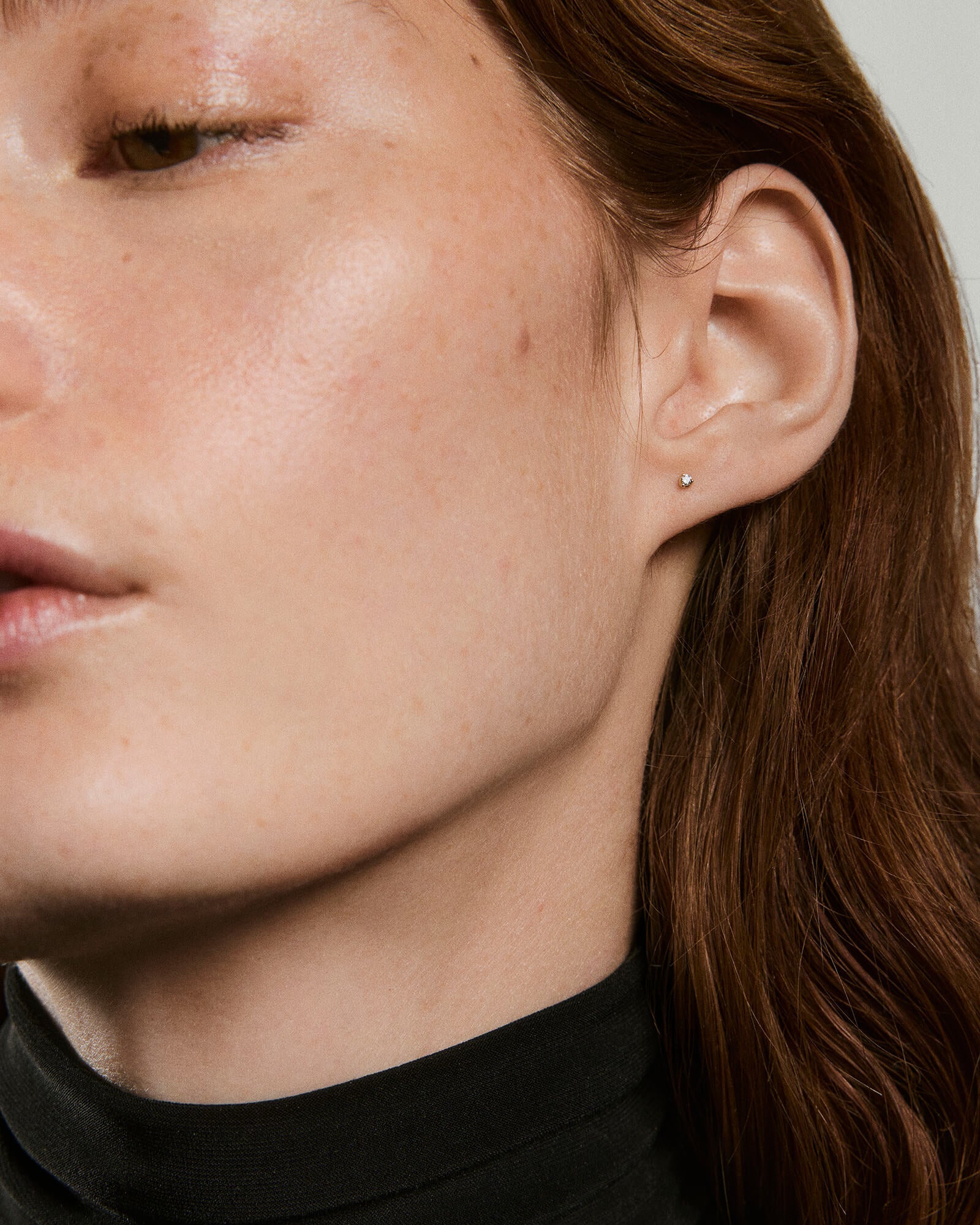 1-EarStylingStudRefresh_PiercingStudio_TinyProngDiamondStud_YG_OnFigSolo_008_f1742c20-cee6-49b7-86e4-9a1e4b9df9c4-1